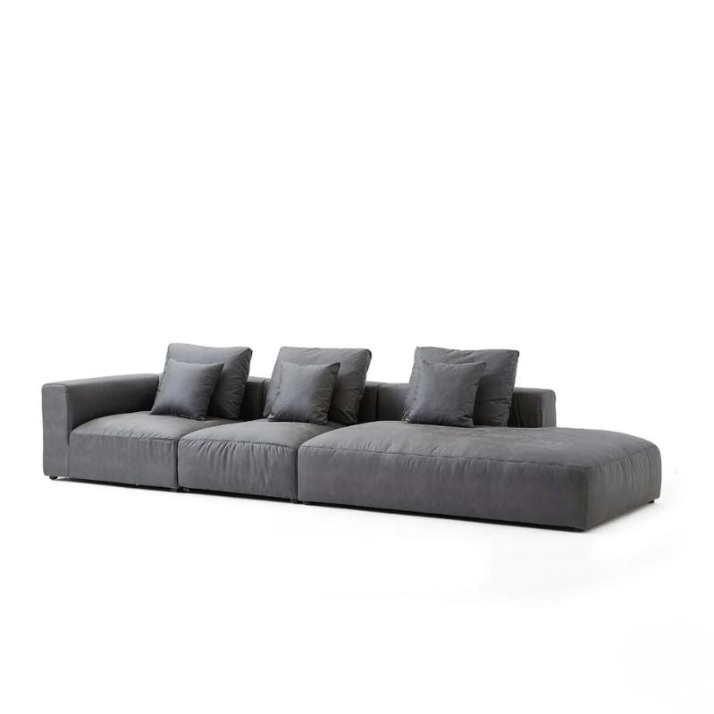 "Gray sofa with four cushions on a white background"