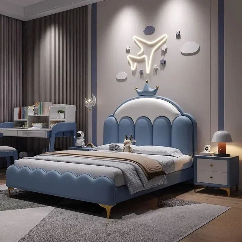 "Modern bedroom with a blue bed, desk, and decorative wall lights."