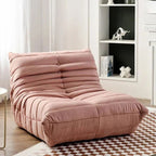 "Pink lounge chair in a room with a bookshelf and checkered floor."