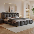 "Modern bedroom with a gray upholstered bed, nightstands, and decorative elements."