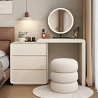 "A modern simple Nordic solid wood makeup dressing table with a round mirror and a padded stool. The table is beige, and the stool is white with a textured design."