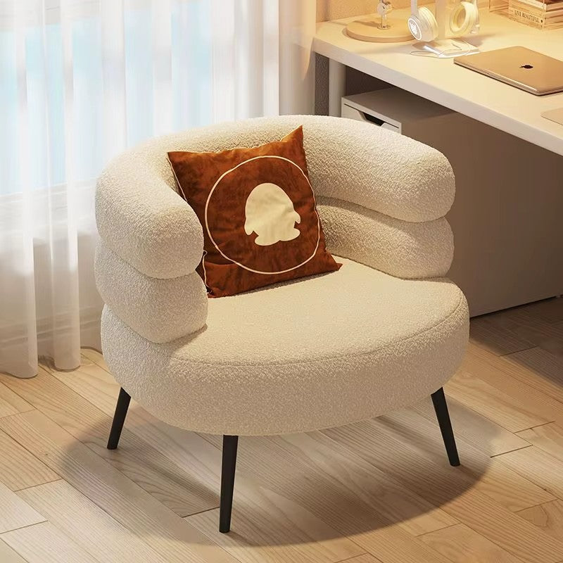 "Modern Accent Chair, Lazy Sofa Accent Chair, Curved Design backrest for Living Room Bedroom \nWhite plush armchair with a brown pillow featuring a face design, placed in a room with a desk and curtains."
