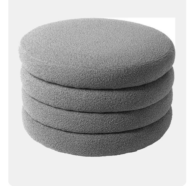 "Stack of gray round cushions on a white background"