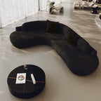 "Modern Luxury Living Room Sofas Minimalist Comfortable Large Size Living Room \nModern black sofa and round coffee table in a minimalistic room."