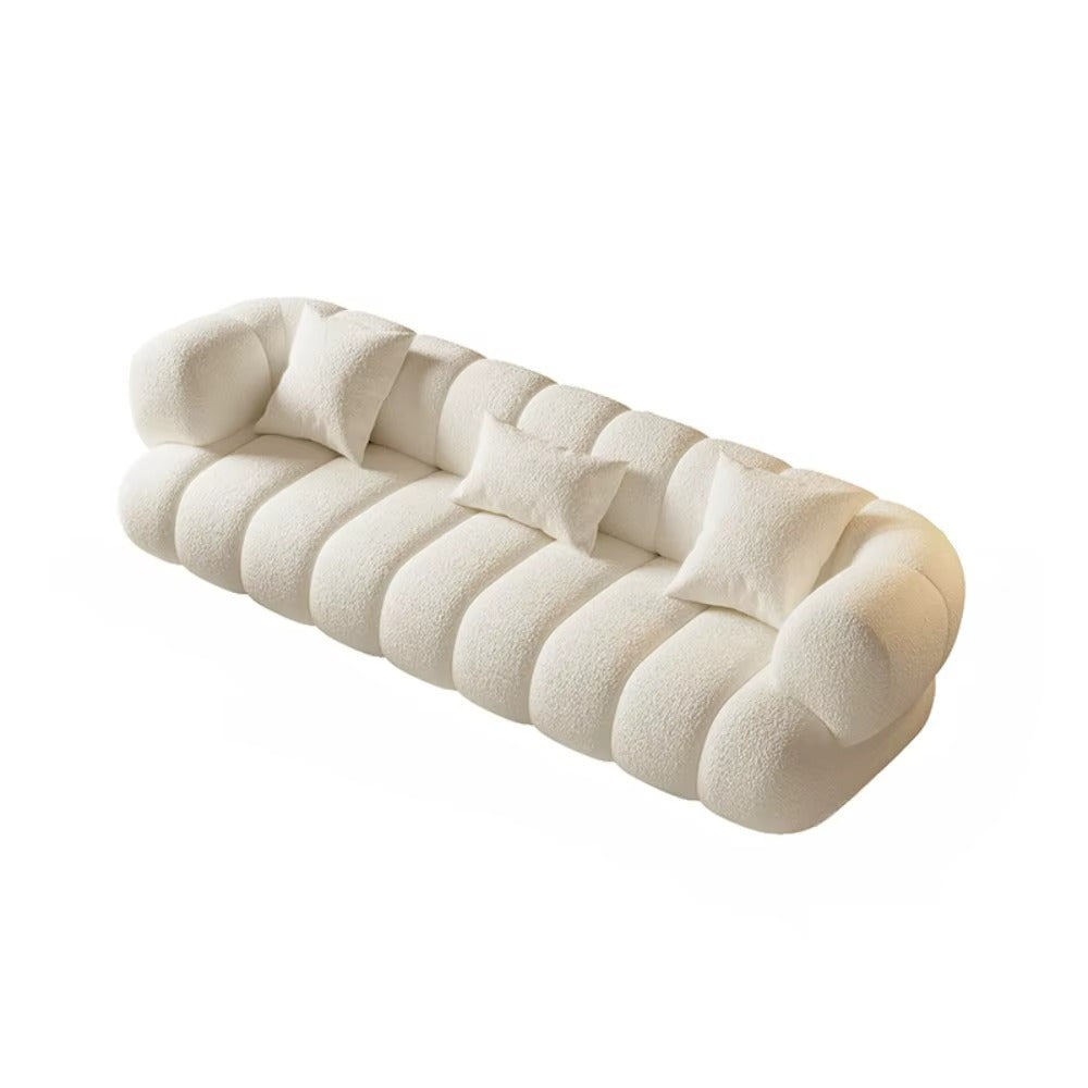 "White sofa with a textured surface on a white background"