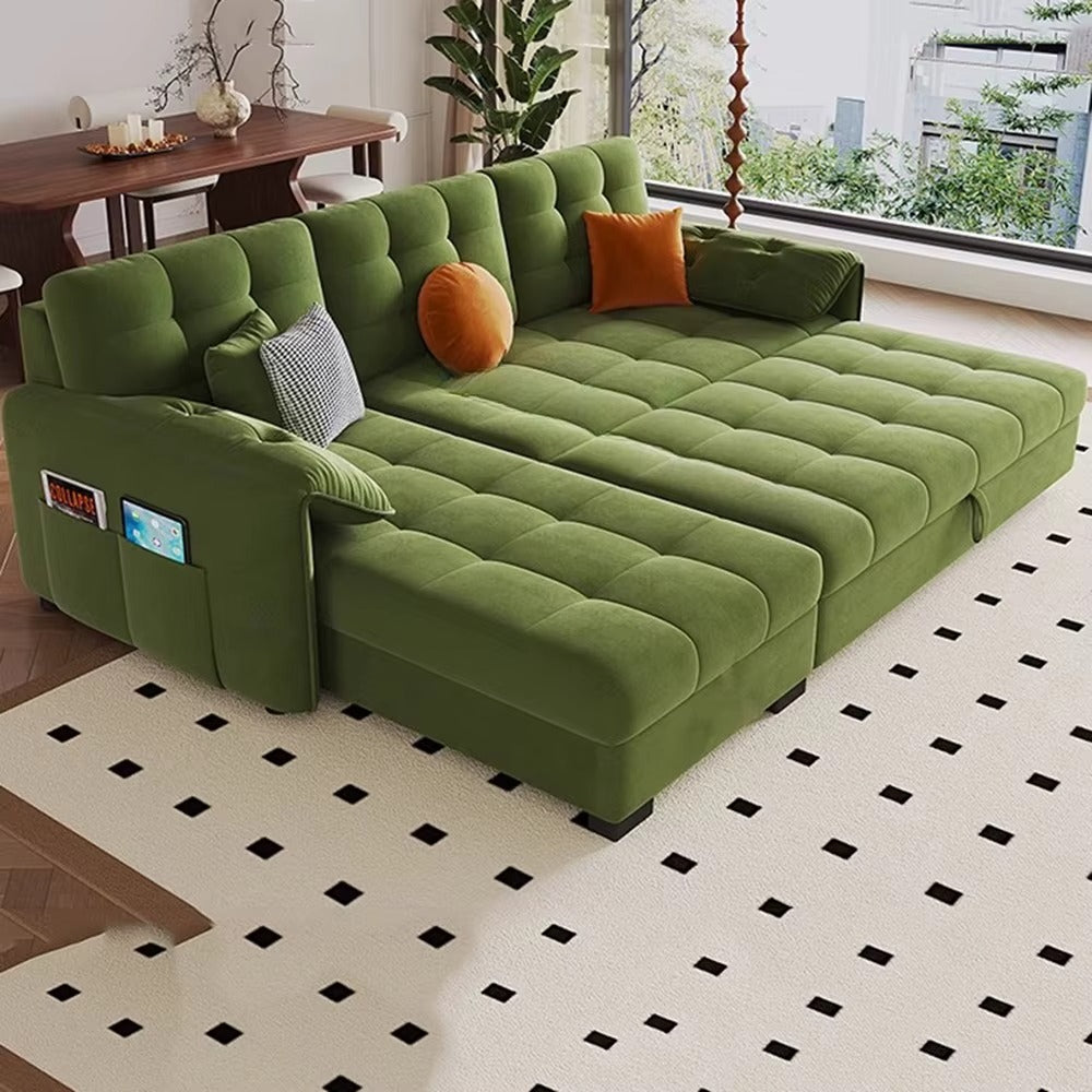 "Green sectional sofa with pull-out bed in a living room setting."