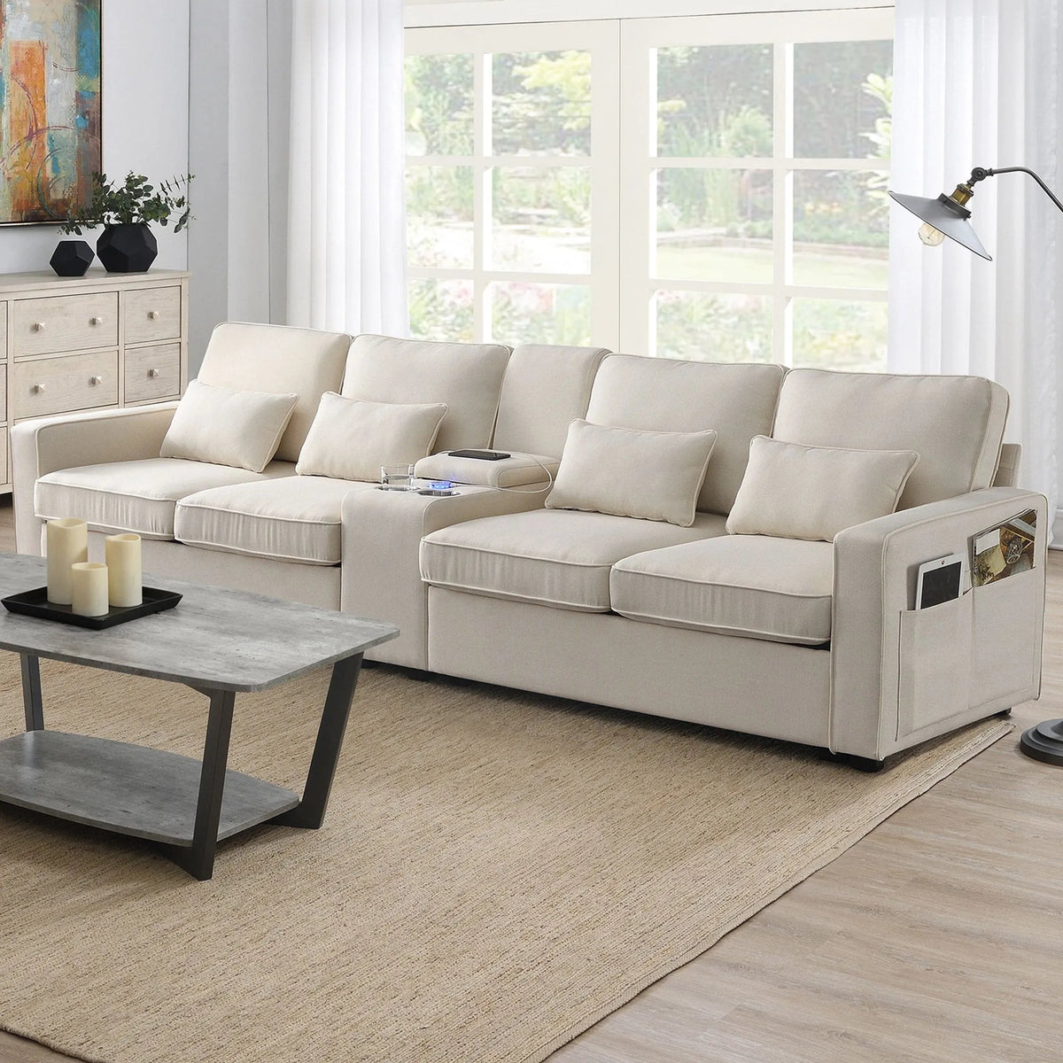 "Beige sectional sofa in a living room with a coffee table and decor items."
