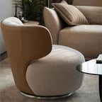 "Modern armchair with a unique design in a living room setting"