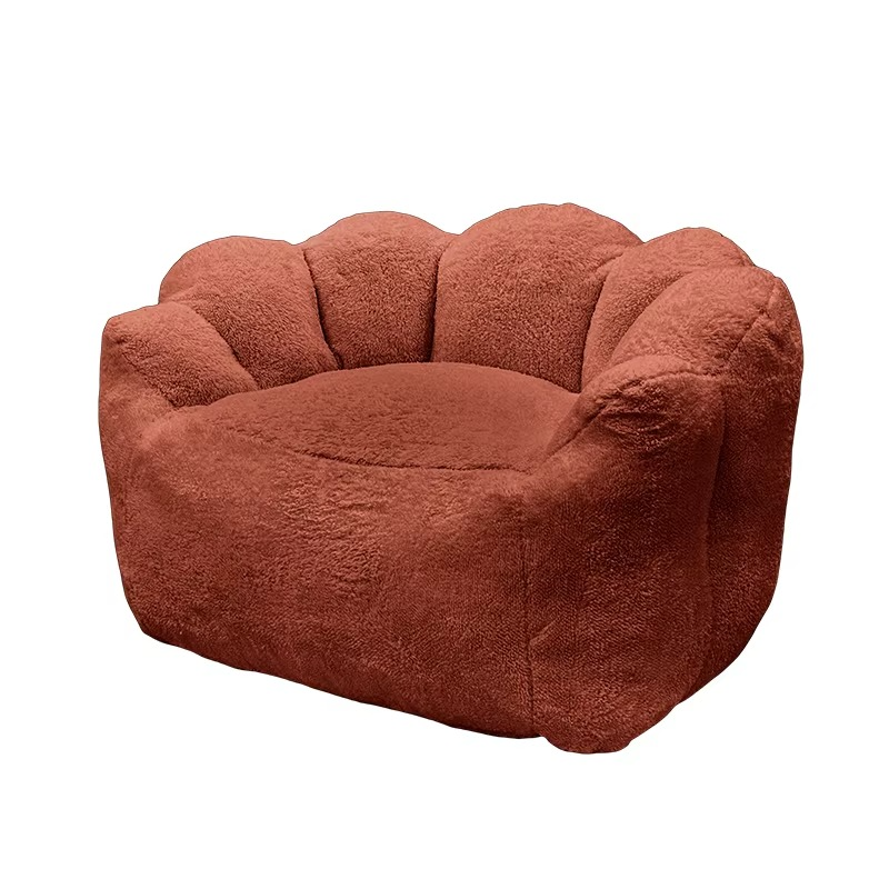Brown plush chair with shell-like design on a white background. Bean bag chair, one seater sofa, Giant bean bag. 