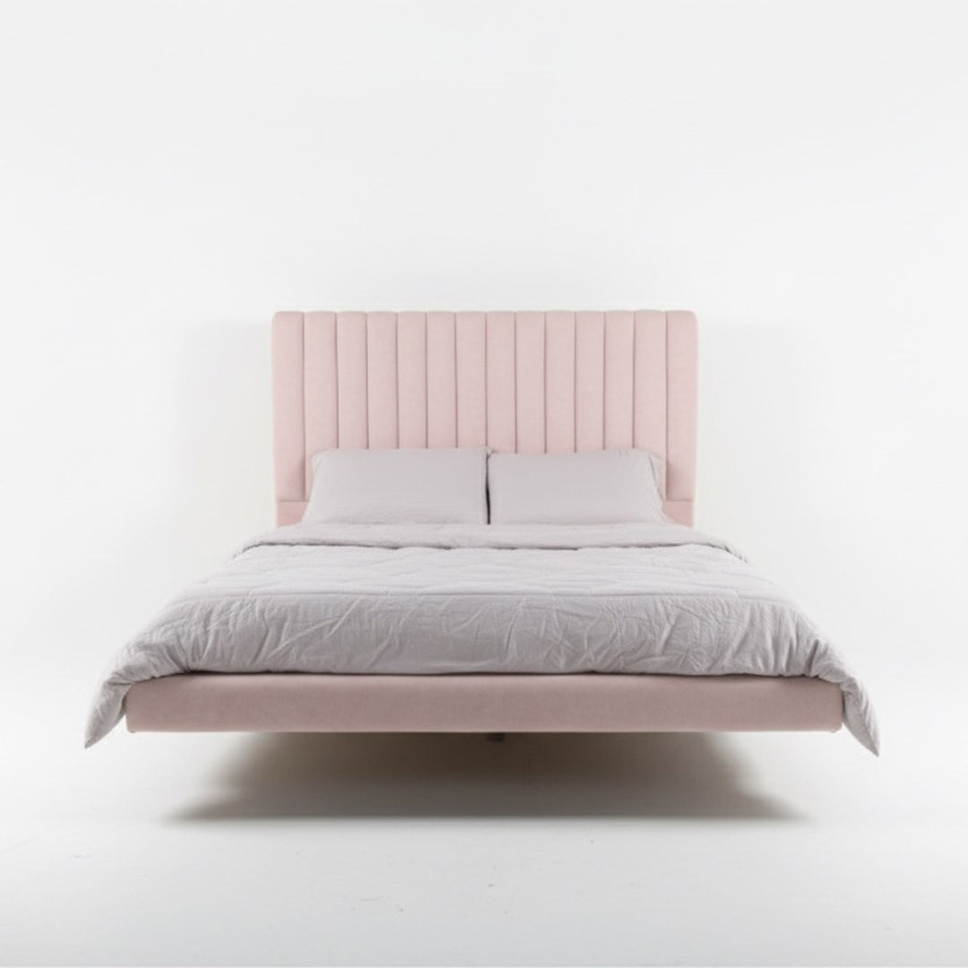 Bed with pink headboard and light gray bedding on a white background. Solid wood bed frame, Minimalist bed frame, Aesthetic modern bedframe. 