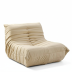 Beige lounge chair on a white background. Modern sofa style, aesthetic caterpillar sofa style, Accent style sofa, living room sofa, indoor furniture, outdoor furniture. 