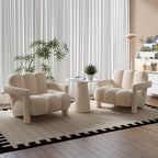 A beige velvet fabric Danish Scandinavian style single sofa chair with a unique design, placed in a room with a round side table and a plant in the background. Indoor furniture, Scandinavian chair design, living room chair, outdoor furniture, bedroom furniture. 