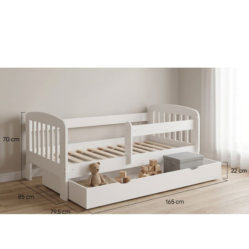White children's bed with measurements on a wooden floor.