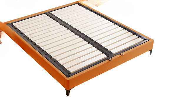 Orange bed frame with wooden slats on a white background. 