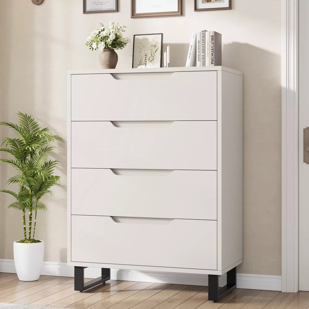 White dresser with four drawers in a room with a plant and framed pictures on the wall. Living room furniture, Chest drawer, Minimalist drawer design.