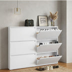White shoe cabinet with multiple shelves and drawers in a room setting.
