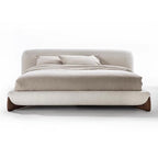 Beige upholstered bed with wooden legs on a white background.  Minimalist bedframe, upholstered platform bed, Japandi minimalist bed design, modern aesthetic bedframe, bedroom reset. 