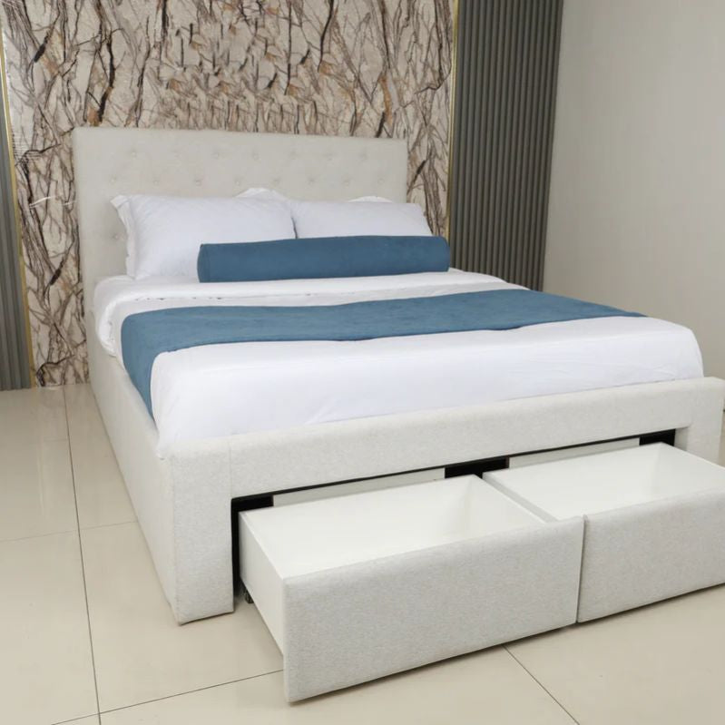 White bed with storage drawers against a neutral wall. Minimalist modern bedframe design, luxury bedframe design, aesthetic bedframe design. 