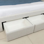 White upholstered storage bench with open storage compartments on a tiled floor.