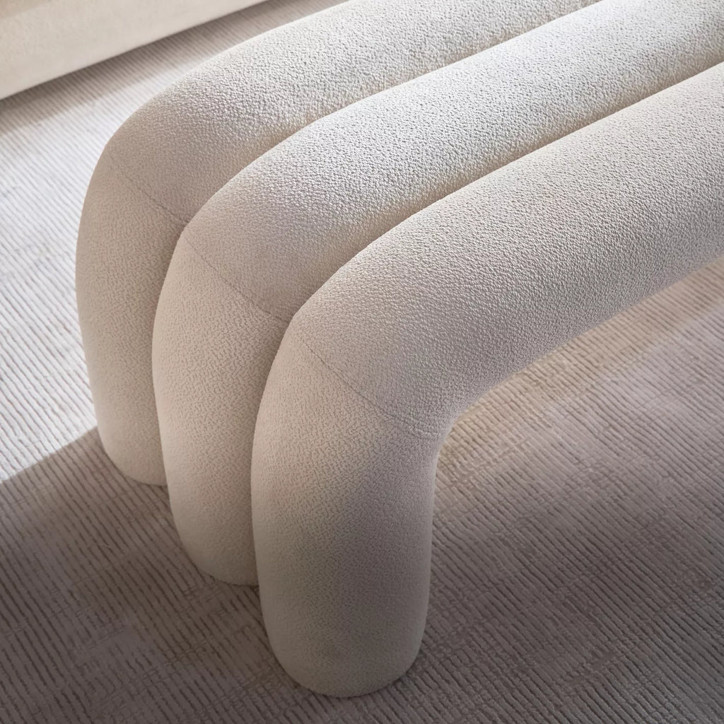 "Close-up of a textured beige sofa with a neutral background"