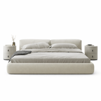 Beige bed with matching nightstands on a white background. Modern bed frame design, upholstered bed, modern cozy bedframe design. 