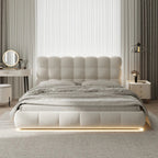 Modern bedroom with a tufted bed and LED strip lighting