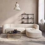 Modern living room with a white sectional sofa, coffee table, and decorative items. L-shape sofa, Velvet sofa, Living room sofa, Sectional sofa.