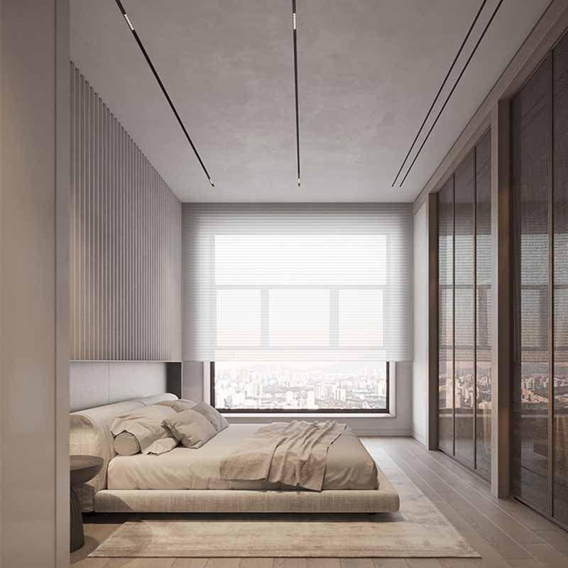 Modern bedroom with a large window and wooden flooring