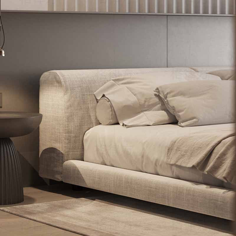 Beige sofa with pillows in a modern living room setting