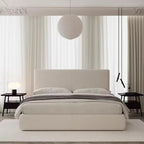 Beige upholstered bed in a modern bedroom with white curtains and minimal decor. Upholstered bed, Minimalist bed, Platform bed. 