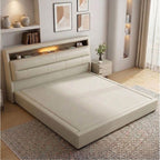 Beige upholstered bed with built-in lighting in a modern bedroom setting.