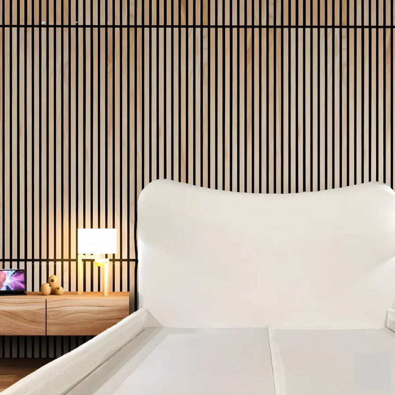 "Modern upholstered bed. \nModern bedroom with white bed and striped wall design"