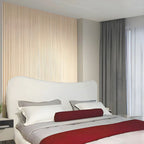 "Modern upholstered bed. Modern bedroom with a bed, pillows, and a red blanket."