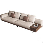 Philips Modern Modular Puffy Style Sofa With One Sided Wooden Armrest. Modern beige sofa with brown cushions and a wooden side table on a white background. Aesthetic modern style sofa, aesthetic minimalist sofa, modern living room design, wood furniture. 