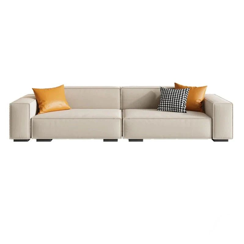 Beige sectional sofa with colorful cushions on a white background. Scandinavian sofa design, classic sofa, living room furniture, minimalist sofa design.  
