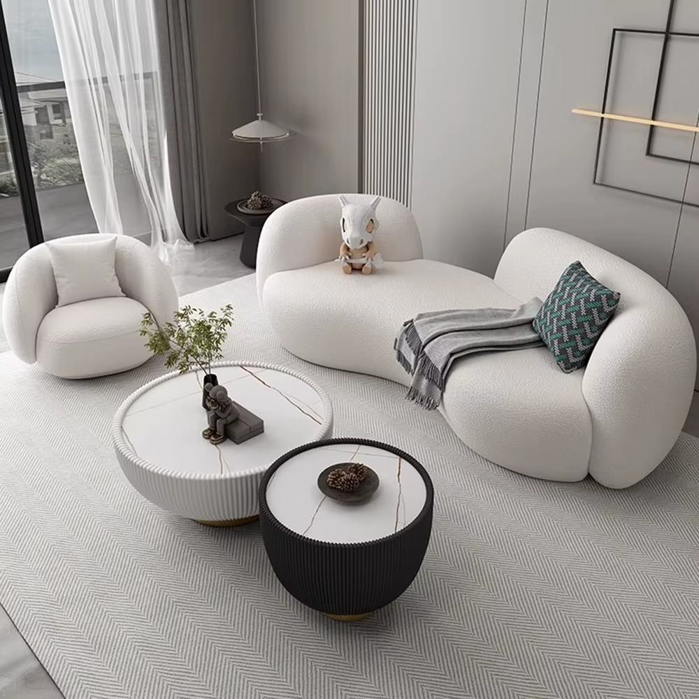 Modern living room with white sofa, coffee table, and decorative items. Living room furniture, Minimalist design, Sectional sofa, Modern living room sofa. 
