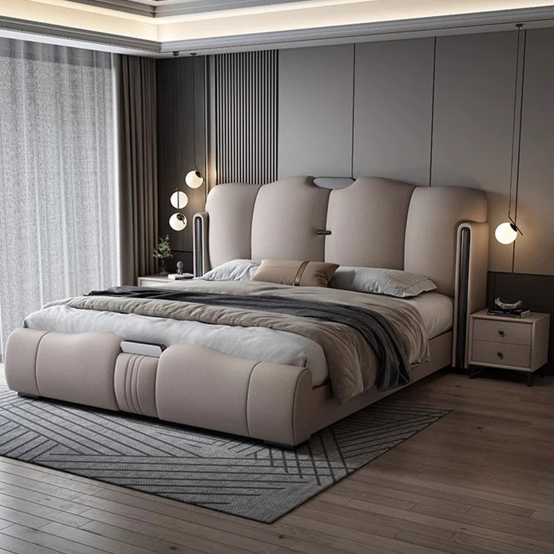 Modern bedroom with a large bed and decorative elements.