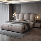 Modern bedroom with a large bed and decorative elements.