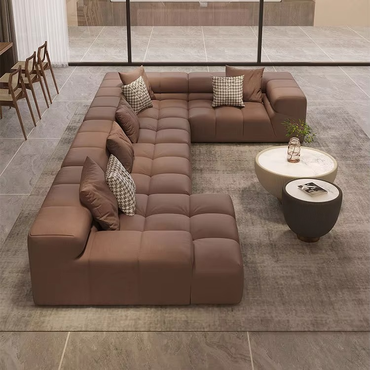 Brown sectional sofa with patterned cushions in a modern living room setting. Sleeper sofa, Sectional sofa, Living room sofa, Aesthetic minimalist sofa. 