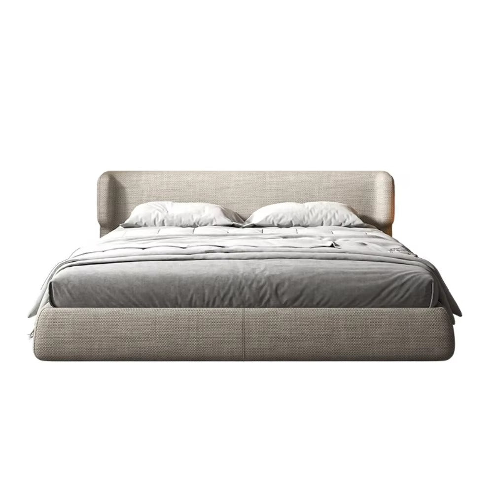 Gray upholstered bed with white bedding on a white background. Upholstered bedframe, Minimalist bedframe design, Bedroom furniture. 