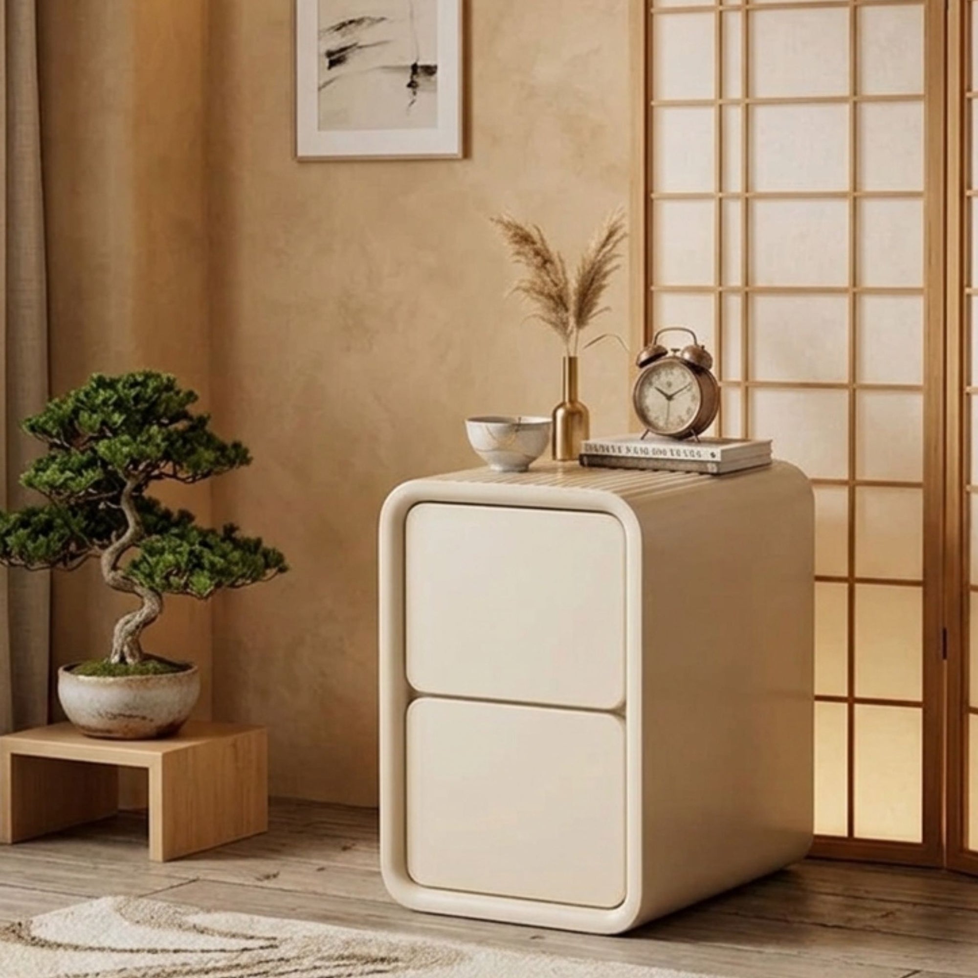 A high-end Vellum Solace Tier Nightstand by Philips Modern Homes featuring a minimalist two-drawer design with rounded edges. The piece is styled in a Japandi-inspired room alongside a bonsai tree, a shoji screen, and warm textured walls to highlight its "Architectural Poise"