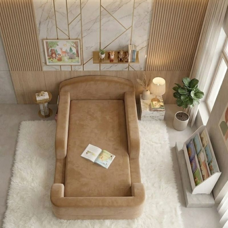 Brown pet bed in a room with a rug, books, and decor