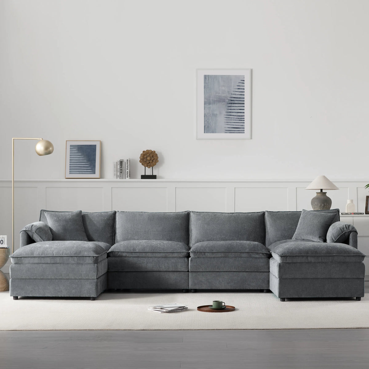 Gray sectional sofa in a modern living room with minimal decor.