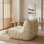 A close-up view of the rear of the Caterpillar Curved Accent Sofa, showing the precise tufting details and rich texture of the high-end upholstery