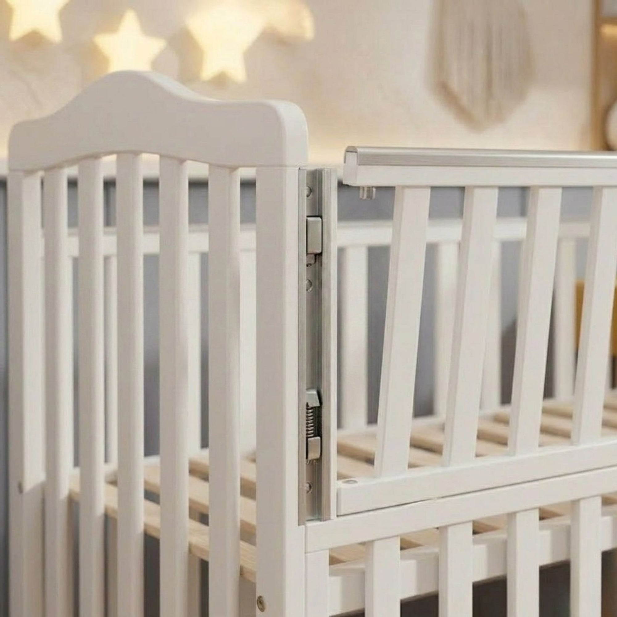 Close-up of the smooth rounded spindles and non-toxic finish on the Celestia 90x140cm nursery crib