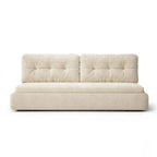 Primary studio shot of the tufted Luna Crescent Sleeper on a clean white background, showcasing the fully extended storage compartments