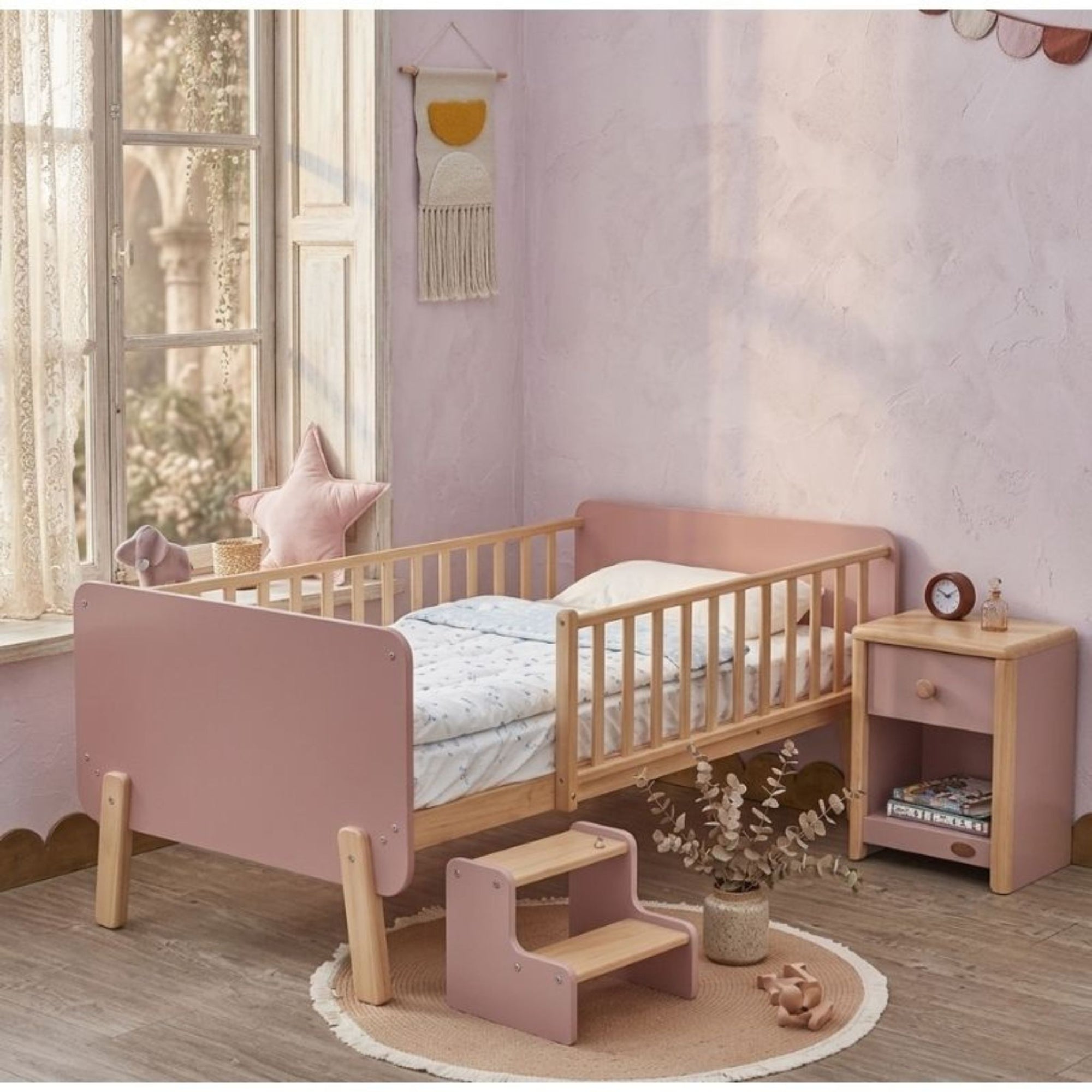 A minimalist UAE children's bedroom featuring the 120x200cm Tuck-Me-In Transition Sleeper as a secure and stylish focal point