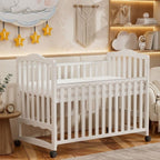 A minimalist UAE nursery setting featuring the 90x140cm Celestia Adjustable Wooden Crib by Philips Modern Homes.