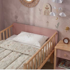 Close-up of the integrated safety side rails and smooth rounded edges on the 120x200cm Tuck-Me-In toddler bed