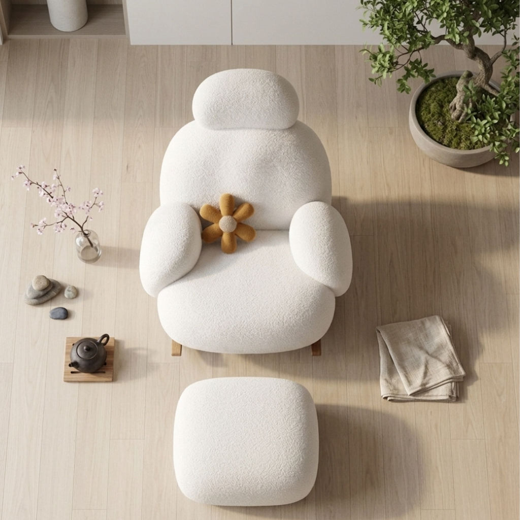 corner.jpg	An angled medium shot of the Velia chair and ottoman viewed from a corner of the room, emphasizing the plush texture, ergonomic cushioning, and natural wood rocker base within a composed Japandi interior space